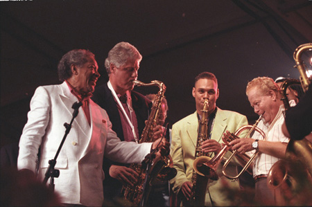 President William J. Clinton Playing the Saxophone at the 40th Anniversary of the Newport Jazz Festival, 1993 - OPA 2524242