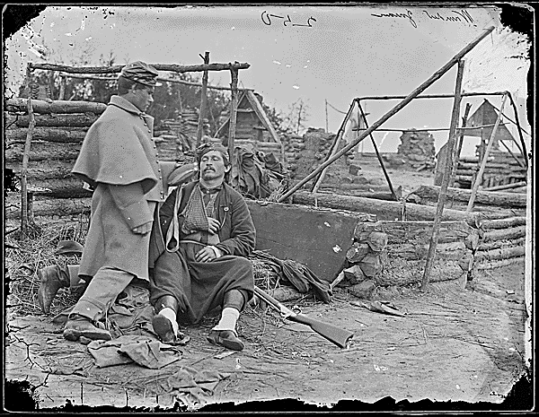 Deserted camp, wounded soldier
