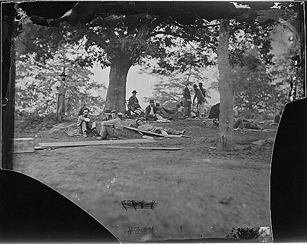 Wounded soldiers under trees