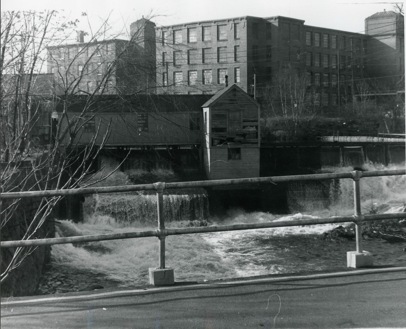 Lowell Plant and Machine shop behind waterfall