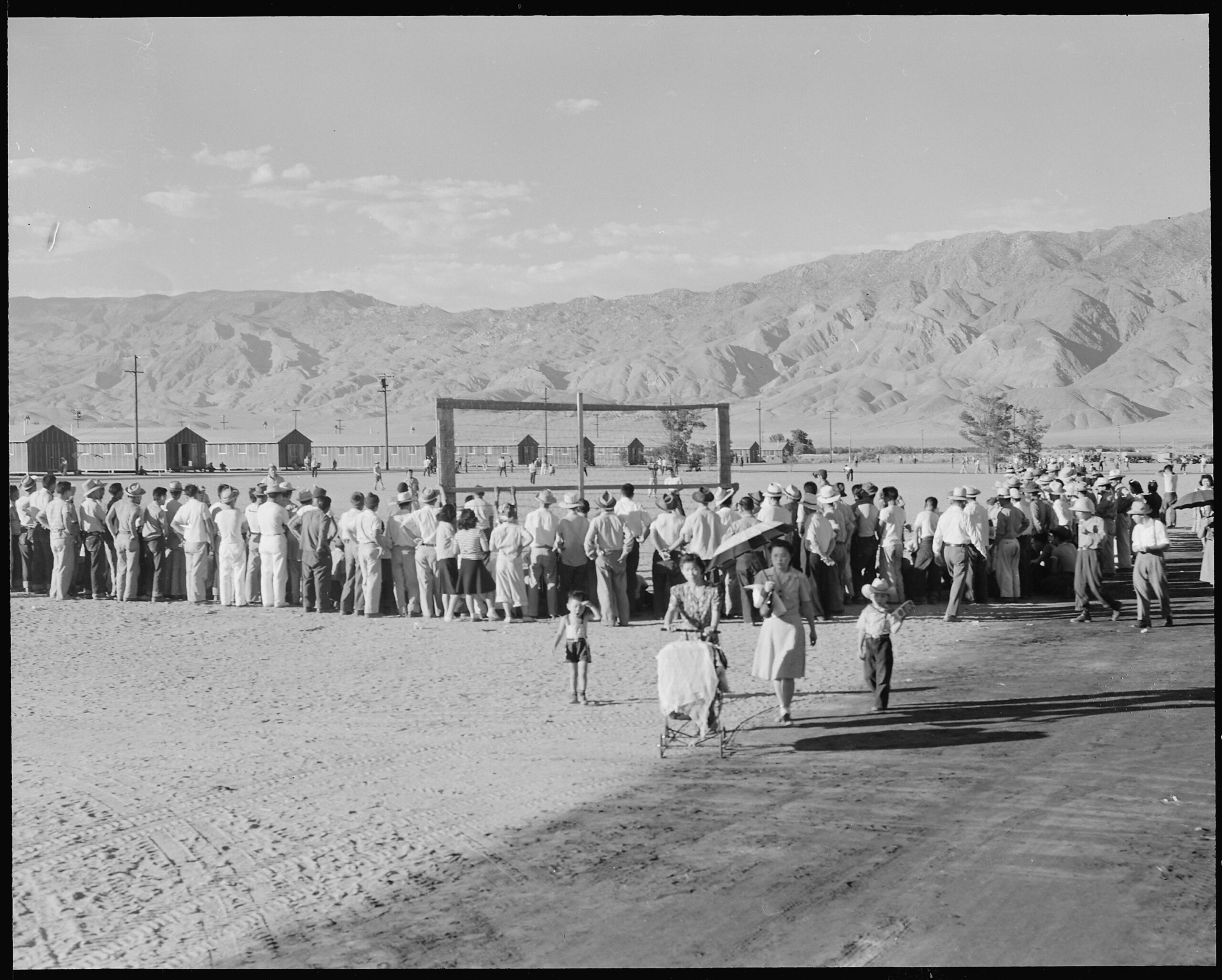 Evacuees watch their league’s baseball game at Manzanar Relocation Center