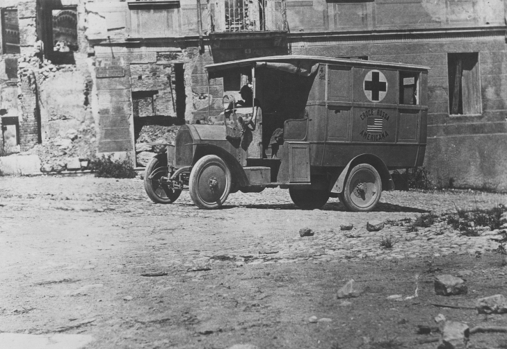American Red Cross – Ambulances – Red Cross in Italy. American Red Cross Ambulance in shelled town in Italy – National Archives Identifier: 20803446