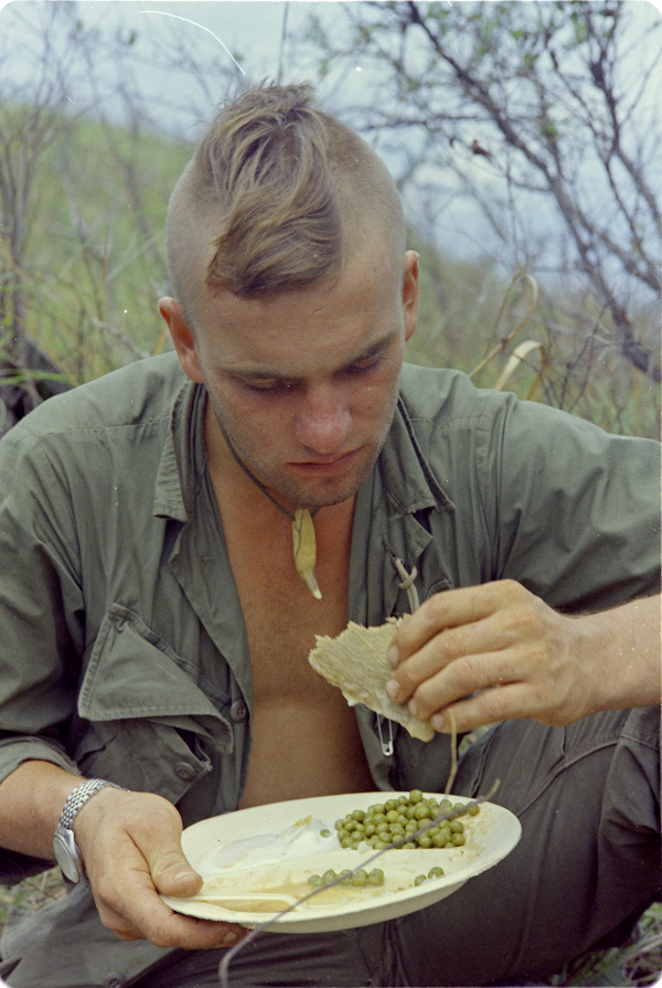 SP4 Hendrick Greenwood eats his first hot meal in five days, September 8, 1967 – National Archives Identifier: 100310256