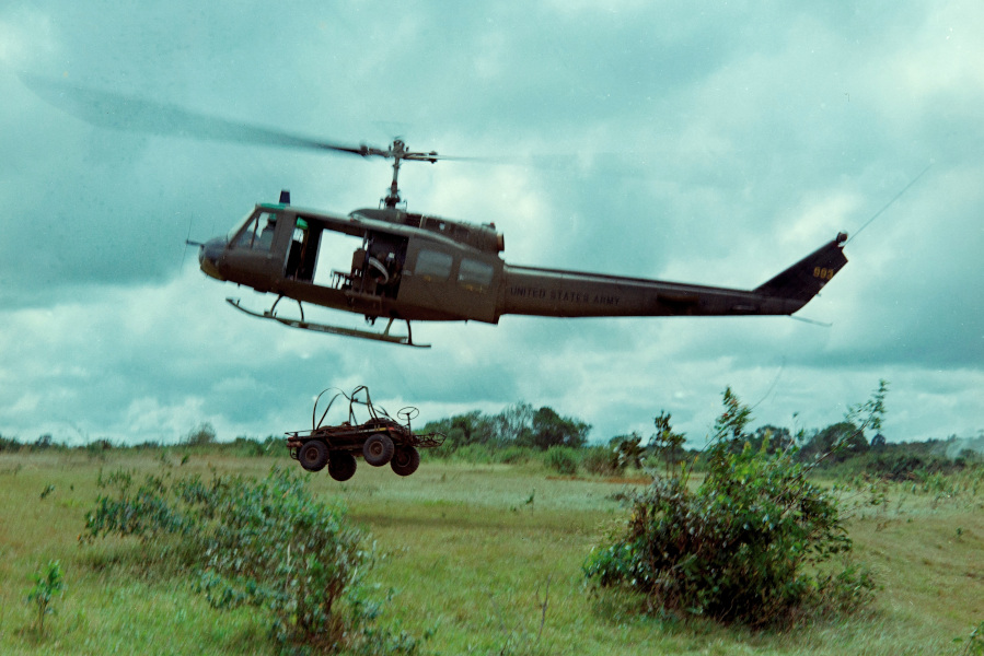 Photograph of a UH1D Helicopter Dropping an Army “Mule” Near Base Camp, February 27, 1966 – National Archives Identifier: 66956591