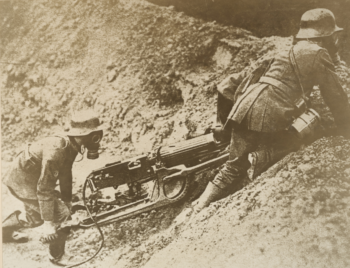 New German machine gun. German machine gunners getting one of their new weapons into position on the firing line  – National Archives Identifier: 31479823