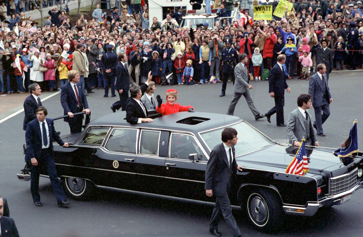 The Reagans’ inaugural parade limo surrounded by Secret Service agents on foot